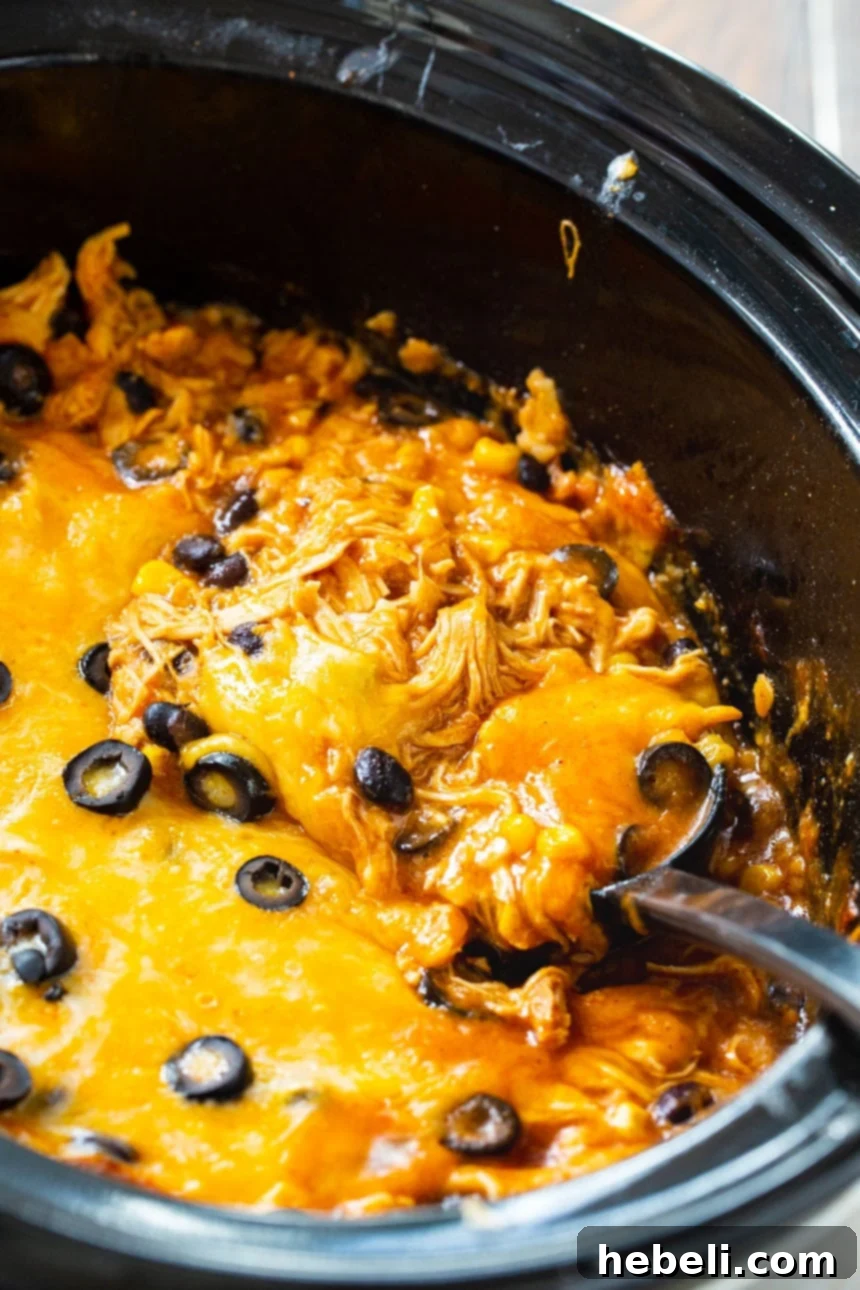 Easy Slow Cooker Chicken Enchilada Casserole 4 Crock Pot Chicken Enchilada Casserole – Incredibly cheesy and packed with flavor.