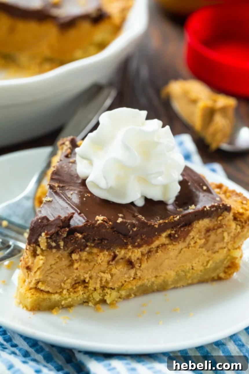 Ultimate Chocolate Peanut Butter Cookie Pie 3 Close-up of a slice of Chocolate Topped Peanut Butter Pie showcasing its layers