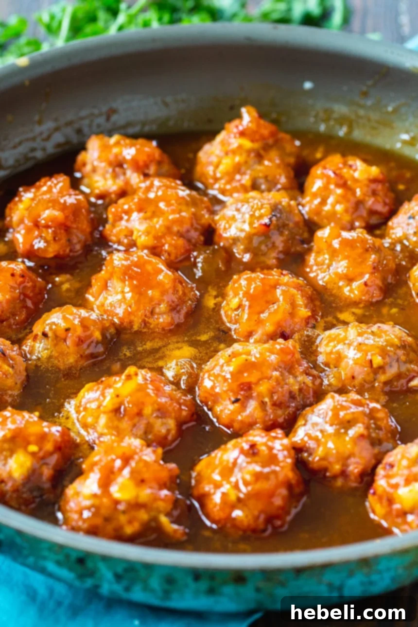Sticky Apricot Ham Delights 3 Close-up of baked ham balls before glazing