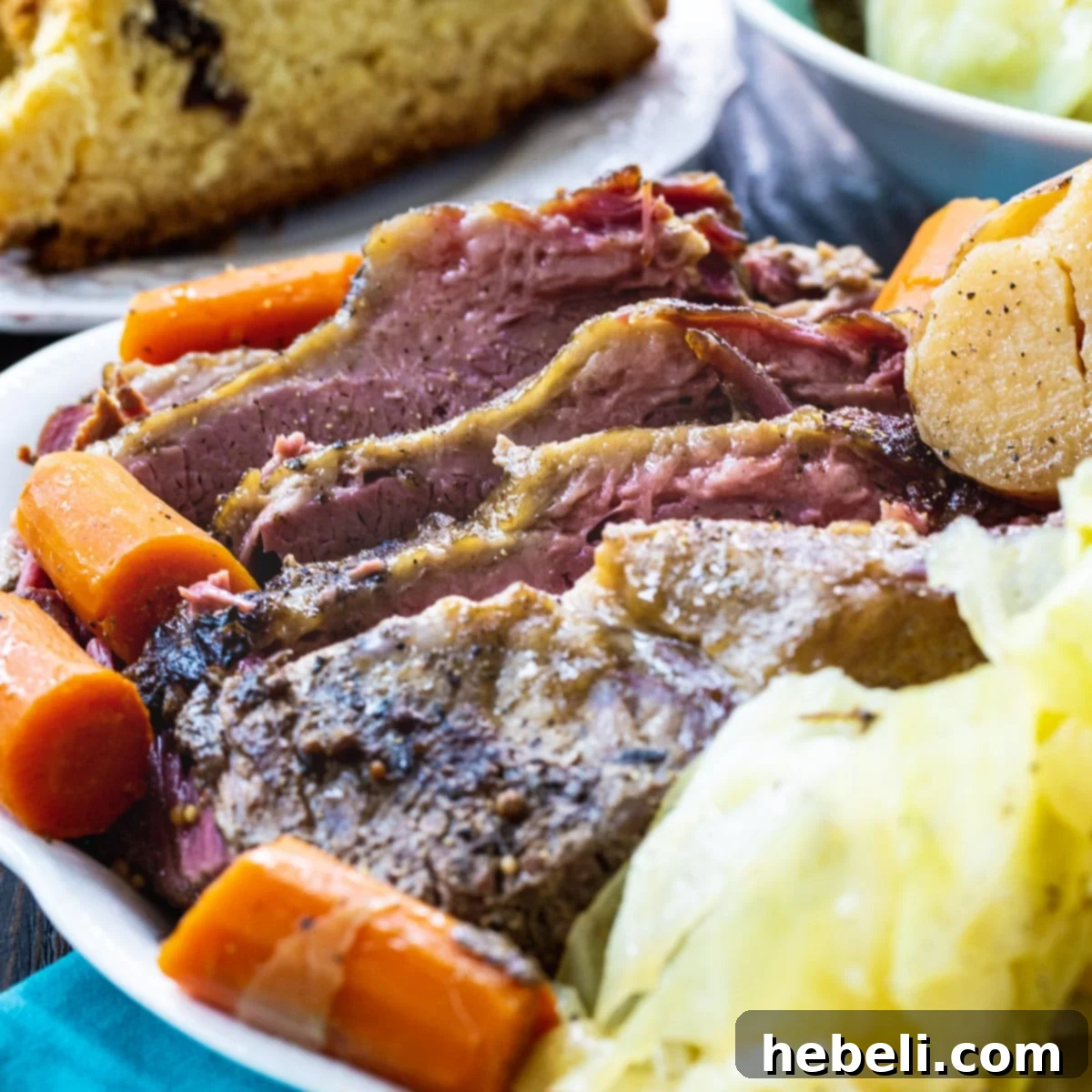 A generous serving of Slow Cooker Corned Beef and Cabbage on a serving platter, ready to be enjoyed.