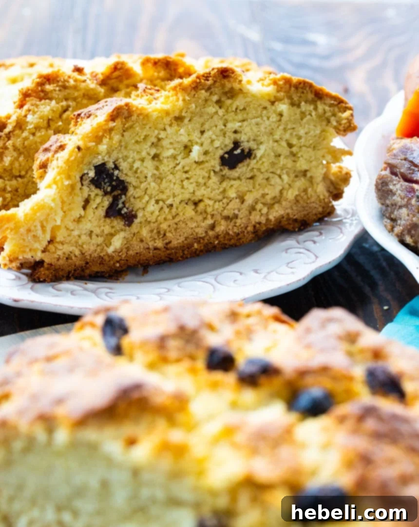 Traditional Irish Soda Bread 4 A delicious slice of Easy Irish Soda Bread with a perfect crust and moist interior.