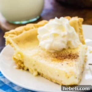 A beautiful slice of Sugar Cream Pie, garnished with whipped cream, as part of the recipe details.