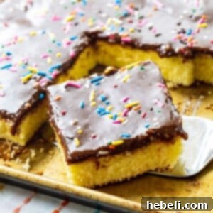 Spatula lifting piece of Cream Cheese Sheet Cake