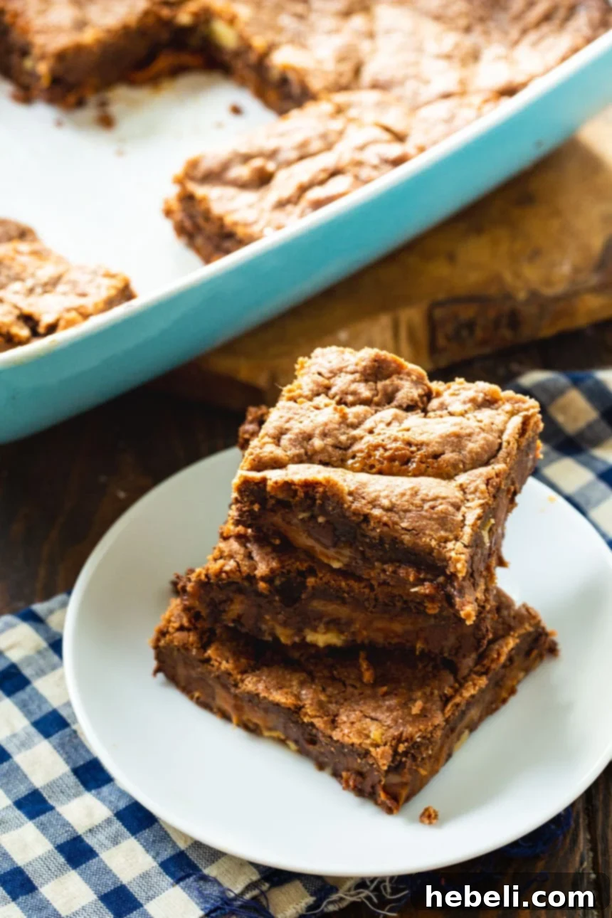 Easy Chocolate Caramel Bars cooling on a wire rack, showcasing their rich texture and ready for cutting