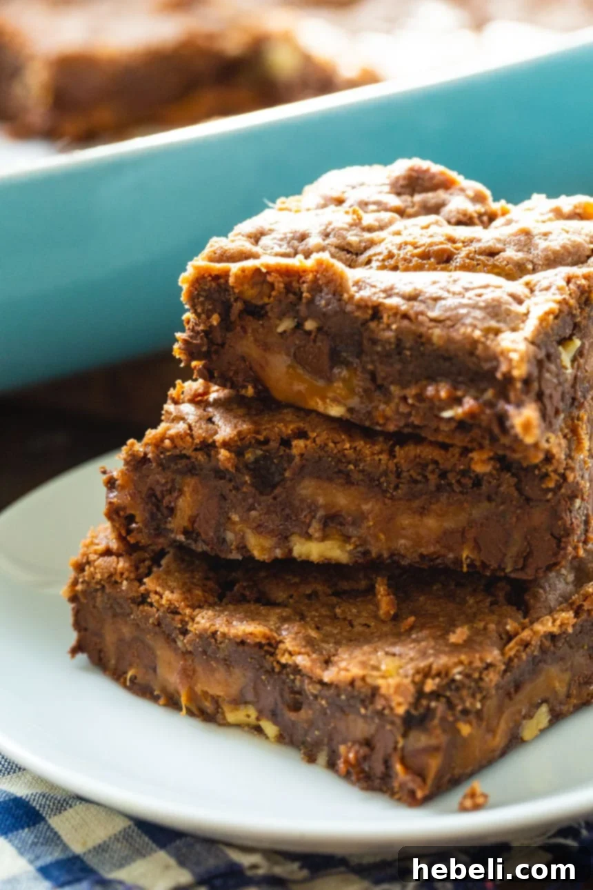 Stacked Easy Chocolate Caramel Bars, showcasing their gooey caramel centers and chocolate layers