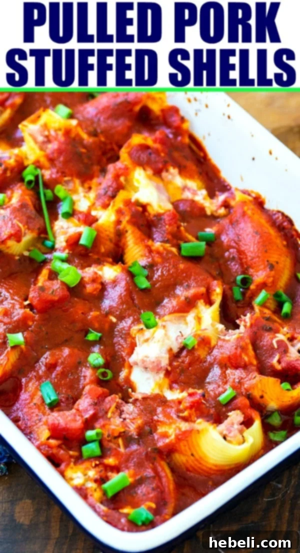 A serving of Pulled Pork Stuffed Shells, garnished with fresh herbs.