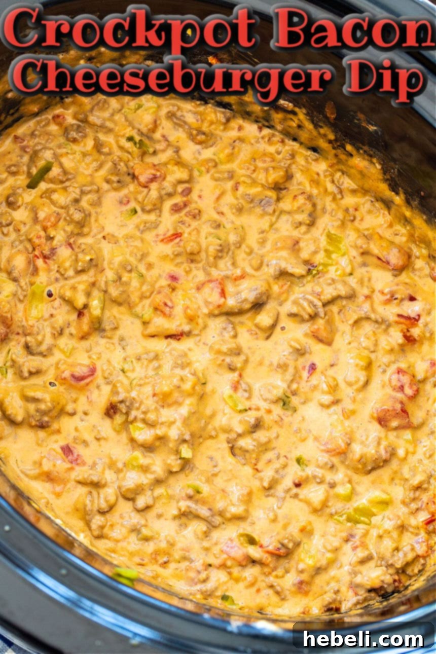 Close-up of bubbling Crockpot Bacon Cheeseburger Dip in a slow cooker, ready for serving.