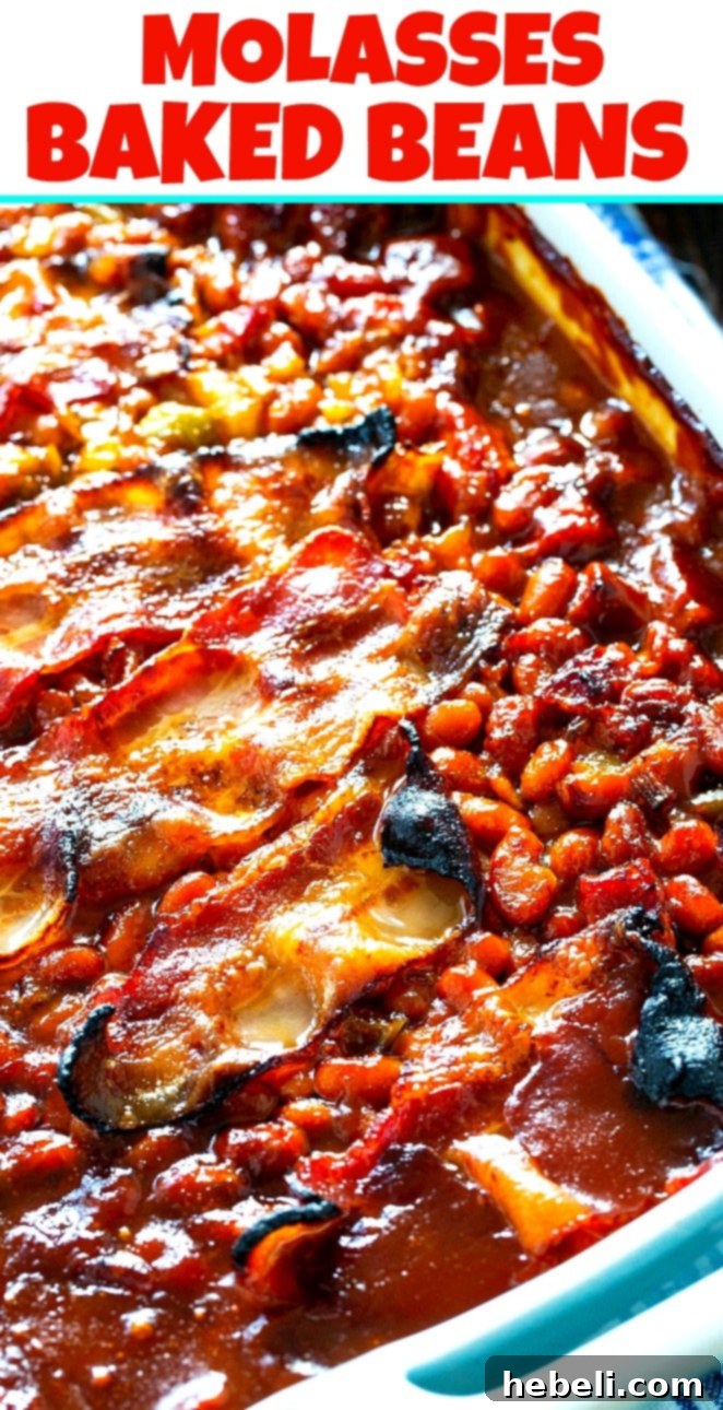 A close-up of Molasses Baked Beans in a baking dish, highlighting the rich, thick sauce, individual beans, and crispy bacon pieces.