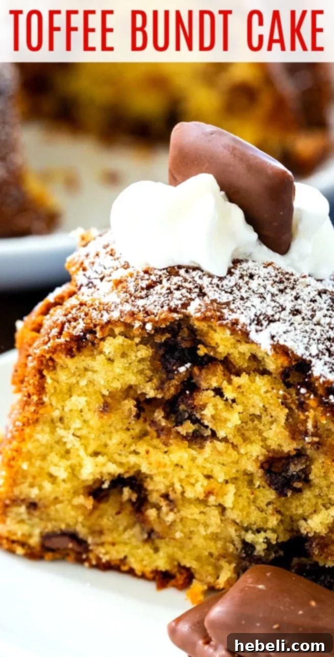 A close-up of a Toffee Bundt Cake with a generous dusting of powdered sugar, showing its moist texture and the delightful mix of Heath bars and chocolate chips.