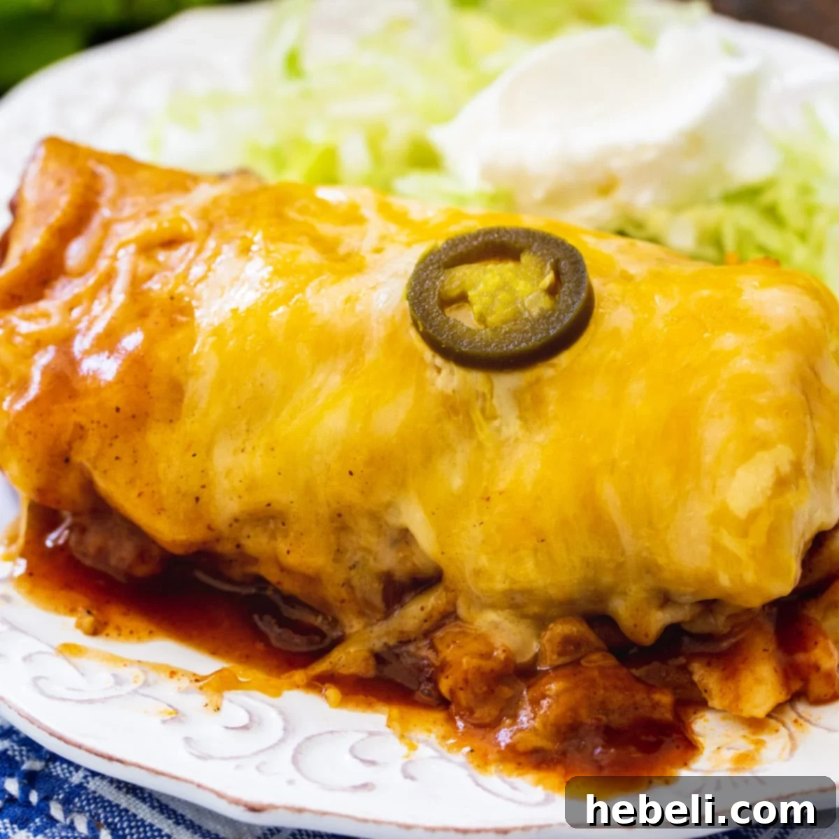 Delicious 3-Ingredient Smothered Burrito served on a plate, ready to eat, garnished with cilantro.