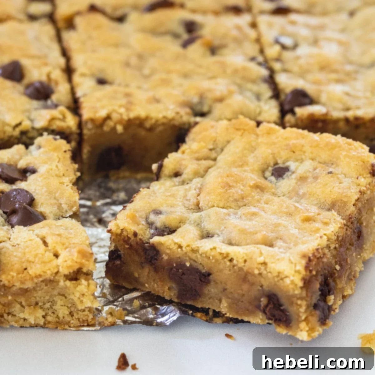 Chewy Toffee Chocolate Bars 2 Delicious Toffee Chocolate Chip bars cut into perfect squares, ready to be enjoyed.