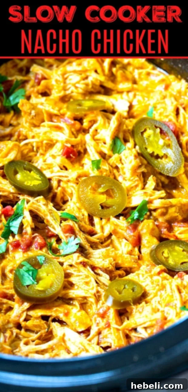Cheesy Fiesta Crock-Pot Chicken 5 Slow Cooker Nacho Shredded Chicken in a crockpot, ready to be scooped.
