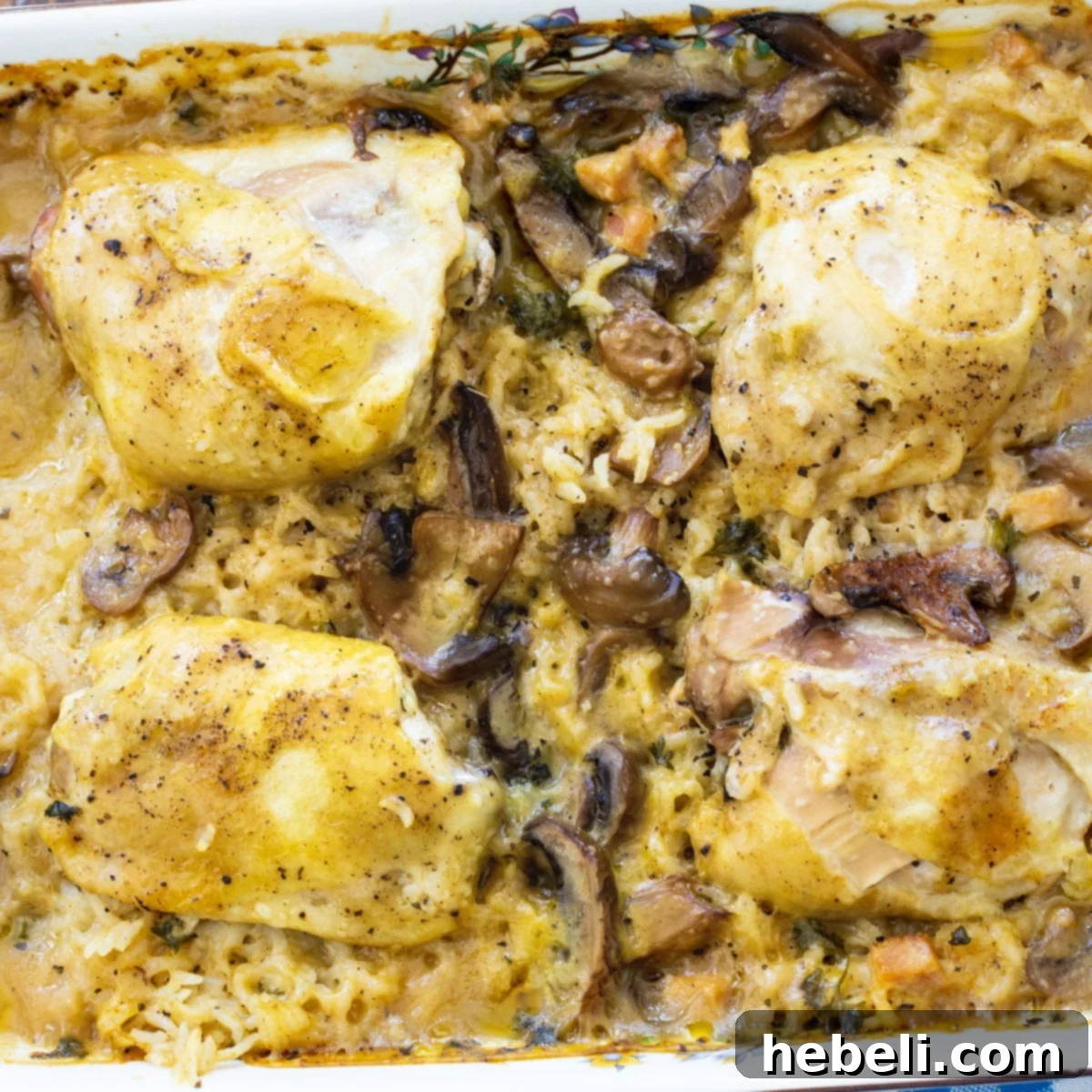 Savory Bacon Chicken Rice Bake 2 Hearty and creamy Baked Chicken and Rice Casserole with bacon, ready to serve from a baking dish.
