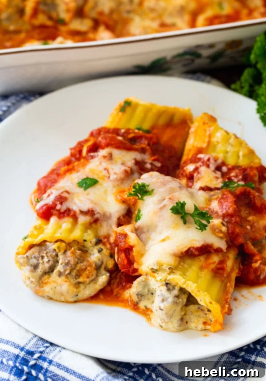 Italian Sausage Manicotti served on a white plate, ready to be enjoyed.