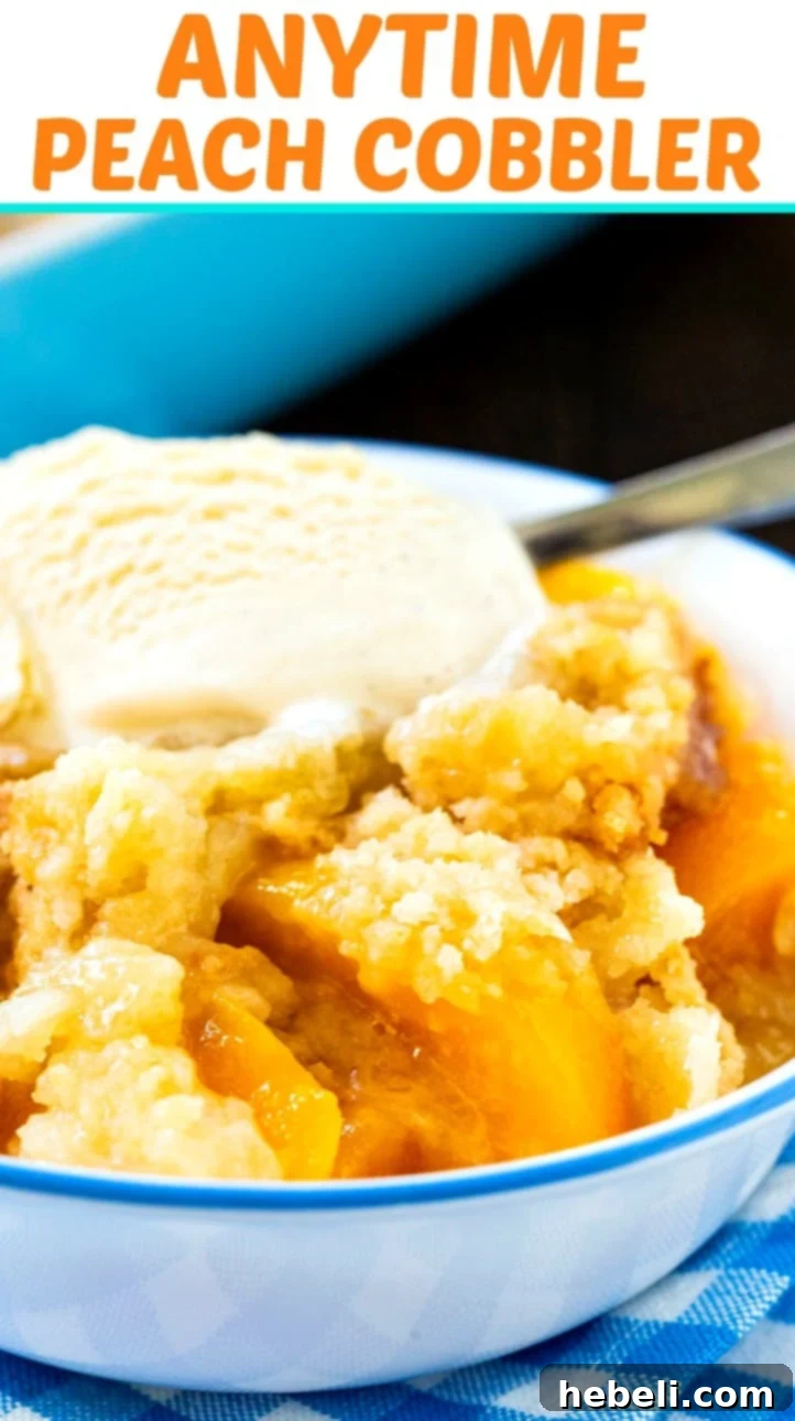 Year-Round Peach Cobbler Delight 7 A close-up view of the golden-brown crust and juicy peach filling of Anytime Peach Cobbler in a bowl.