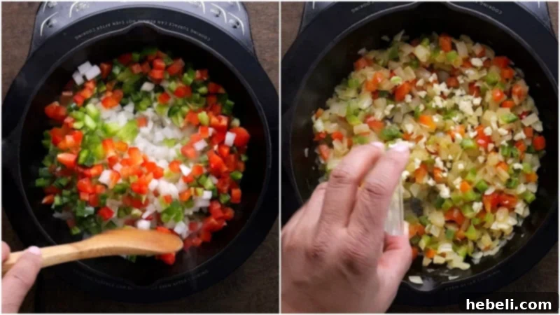 Close-up of diced onions, bell peppers, and jalapenos sautéing in a skillet, turning translucent.