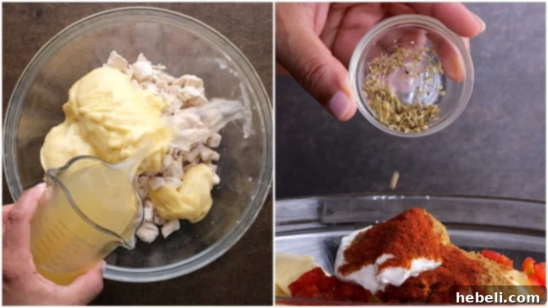A large bowl filled with creamy chicken mixture, ready for layering, showcasing the texture and consistency.