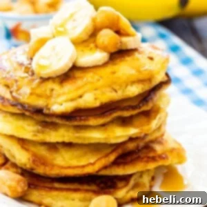 Stack of Macadamia Nut Banana Pancakes on a white plate