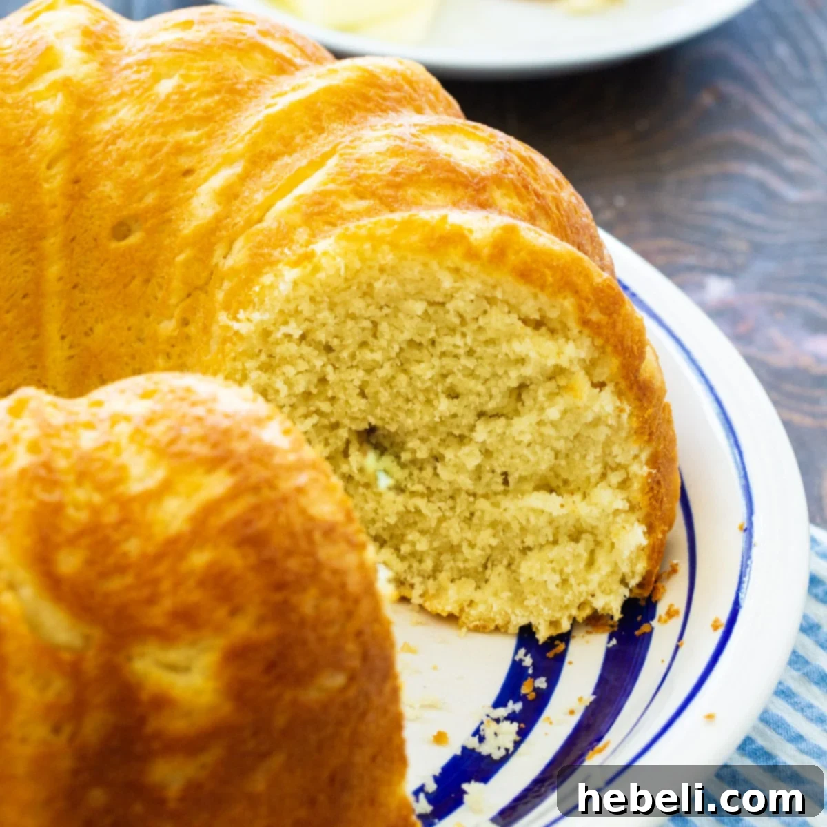 Sally Lunn: A Classic British Bake 2 A beautiful loaf of Sally Lunn Bread on a white plate, ready to be served.