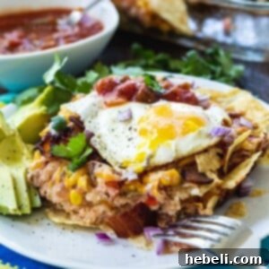 Bacon and Egg Chilaquiles on a white plate