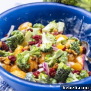 Mandarin Broccoli Salad ready to be served in a blue bowl