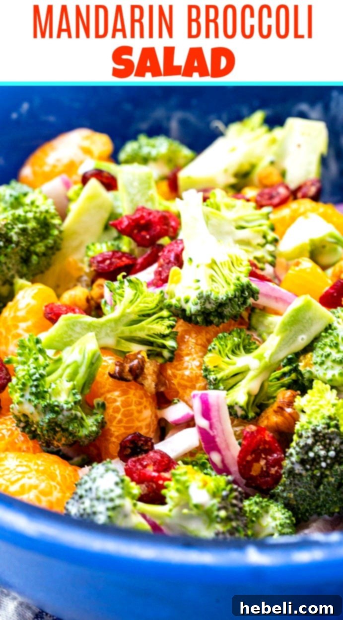 Large serving bowl of Mandarin Broccoli Salad, a colorful and healthy side dish.