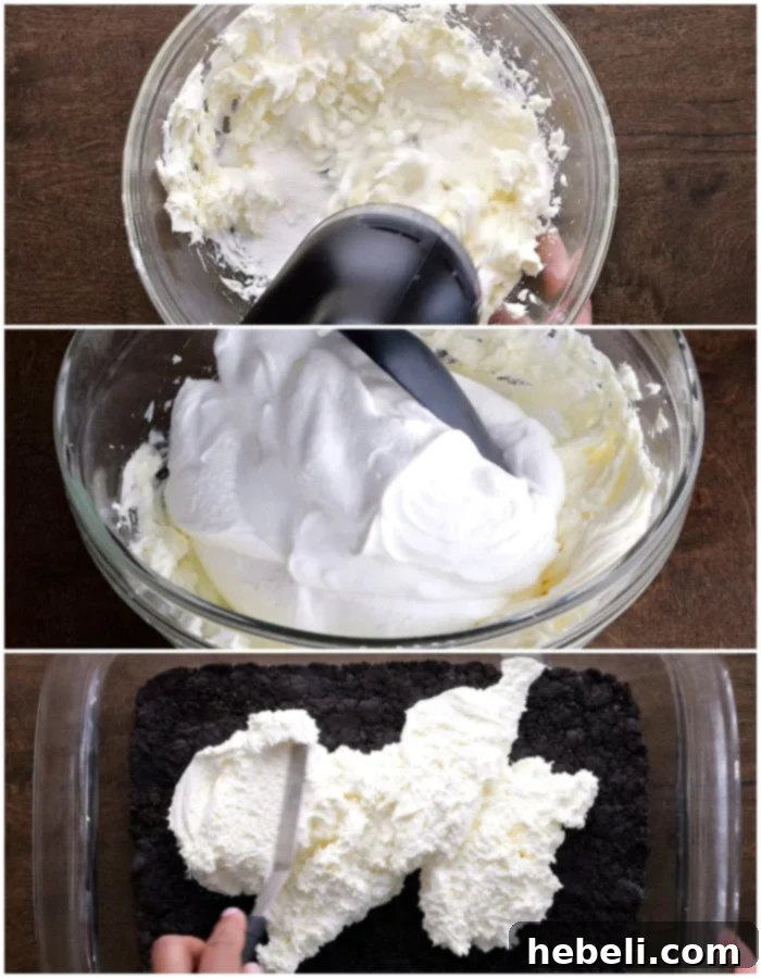 Mixing ingredients for the cream cheese layer using an electric mixer.