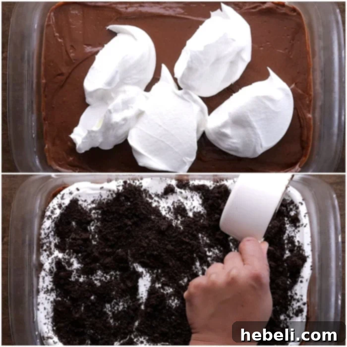Spreading Cool Whip and sprinkling crushed Oreos on top of the dessert.