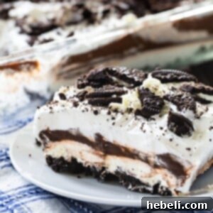 Slice of Oreo Delight on a small plate, showing off its beautiful layers.