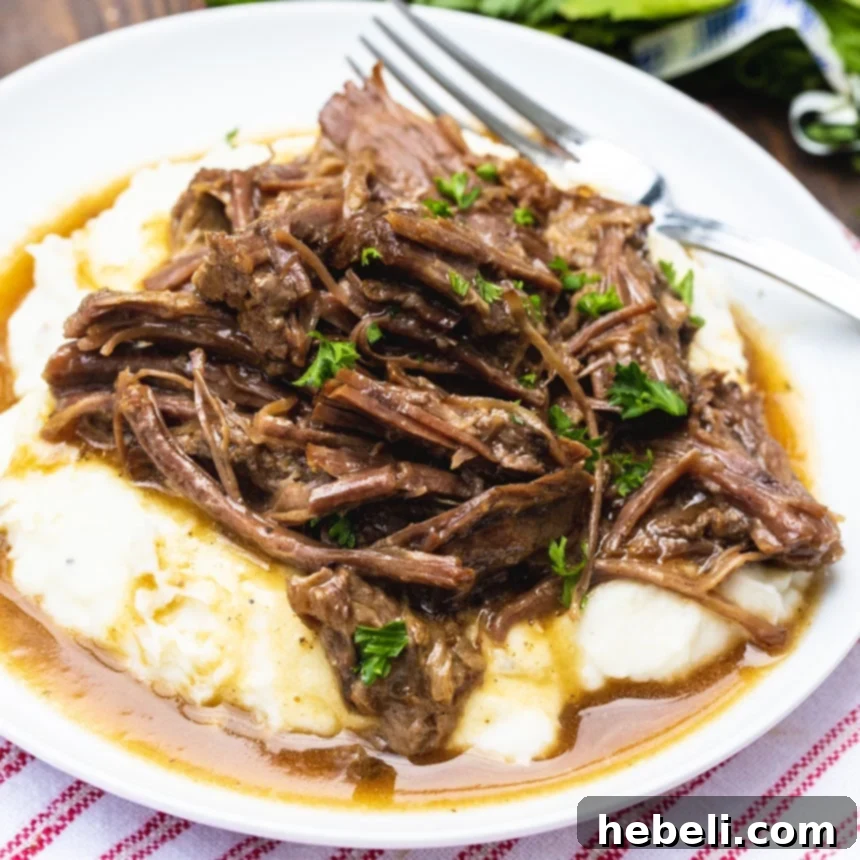 Instant Pot Foolproof 3-Packet Pot Roast 2 Instant Pot Pot Roast served over mashed potatoes with a rich gravy.
