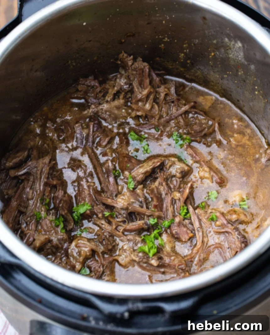 Instant Pot Foolproof 3-Packet Pot Roast 3 3-Packet Pot Roast cooking inside an Instant Pot, showing the seasoning packets.
