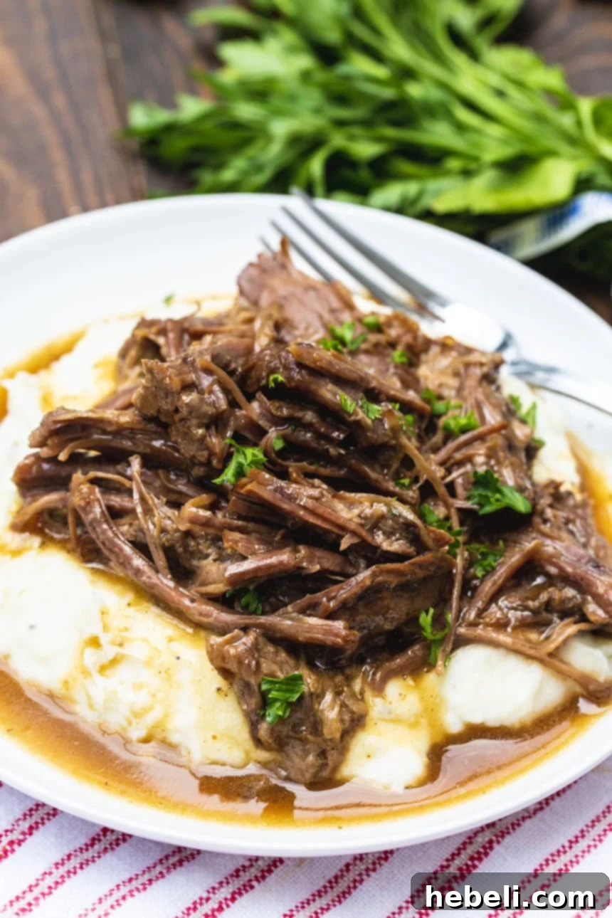 Instant Pot Foolproof 3-Packet Pot Roast 4 Easy 3-Packet Pot Roast served over creamy mashed potatoes, ready to eat.