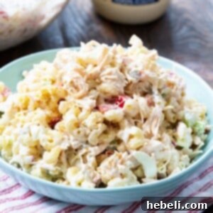 Chicken Macaroni Salad in a light blue serving bowl, perfect for sharing.