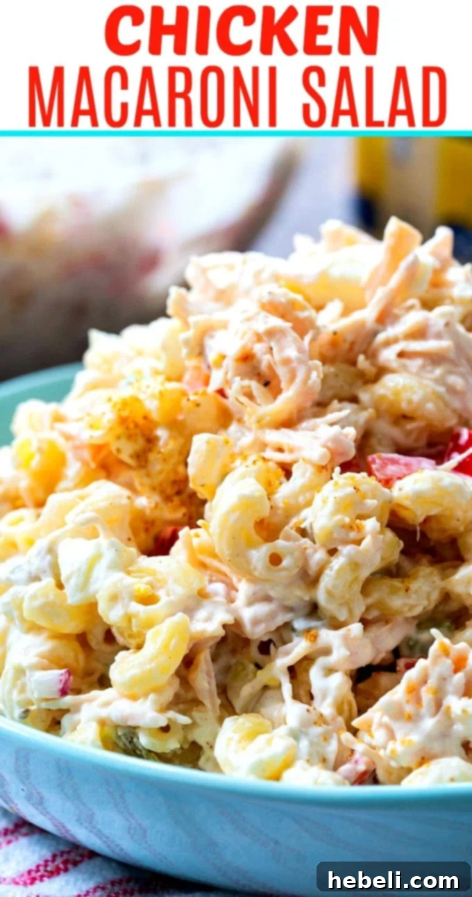 Creamy Chicken Pasta Salad 6 A large blue serving bowl filled with creamy Chicken Macaroni Salad, ready for a gathering.