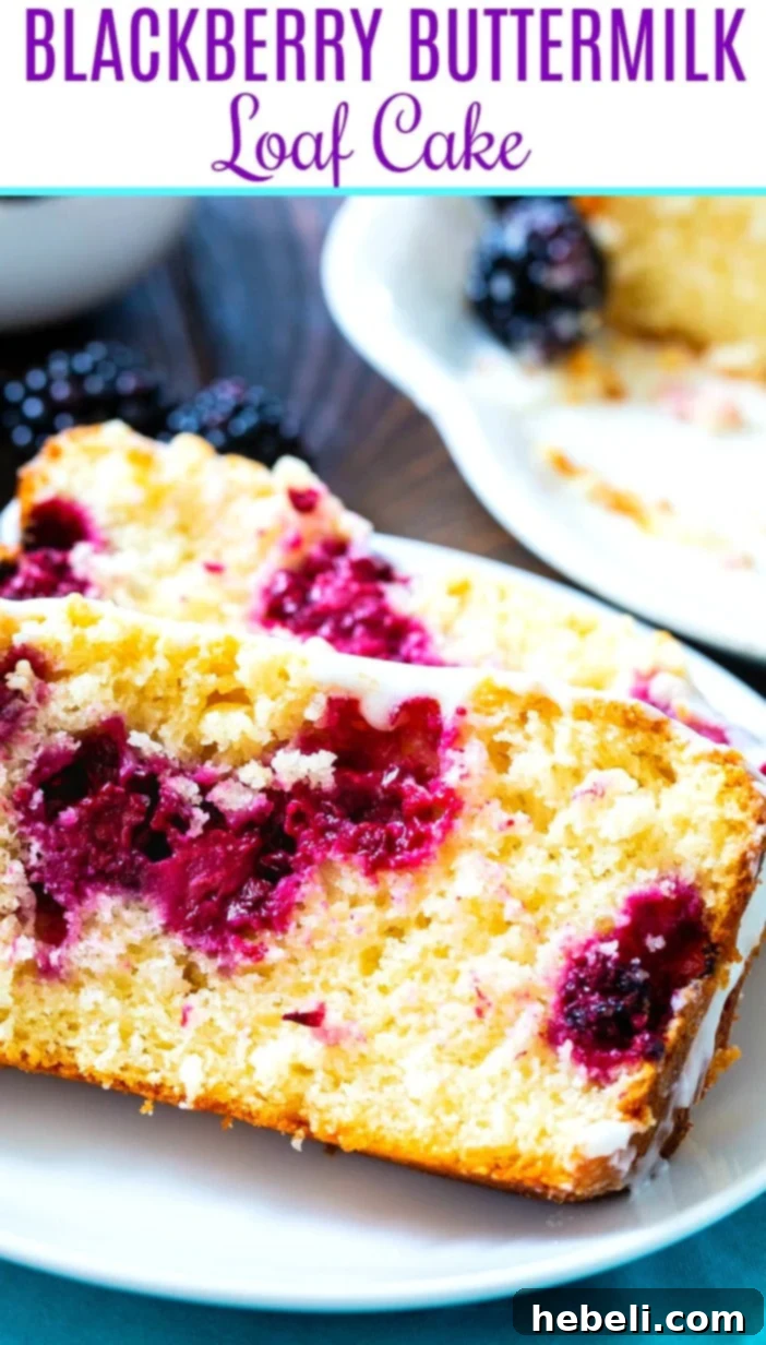 Beautifully sliced Buttermilk Loaf Cake with Blackberries, showing a generous amount of fruit and a perfectly glazed top.