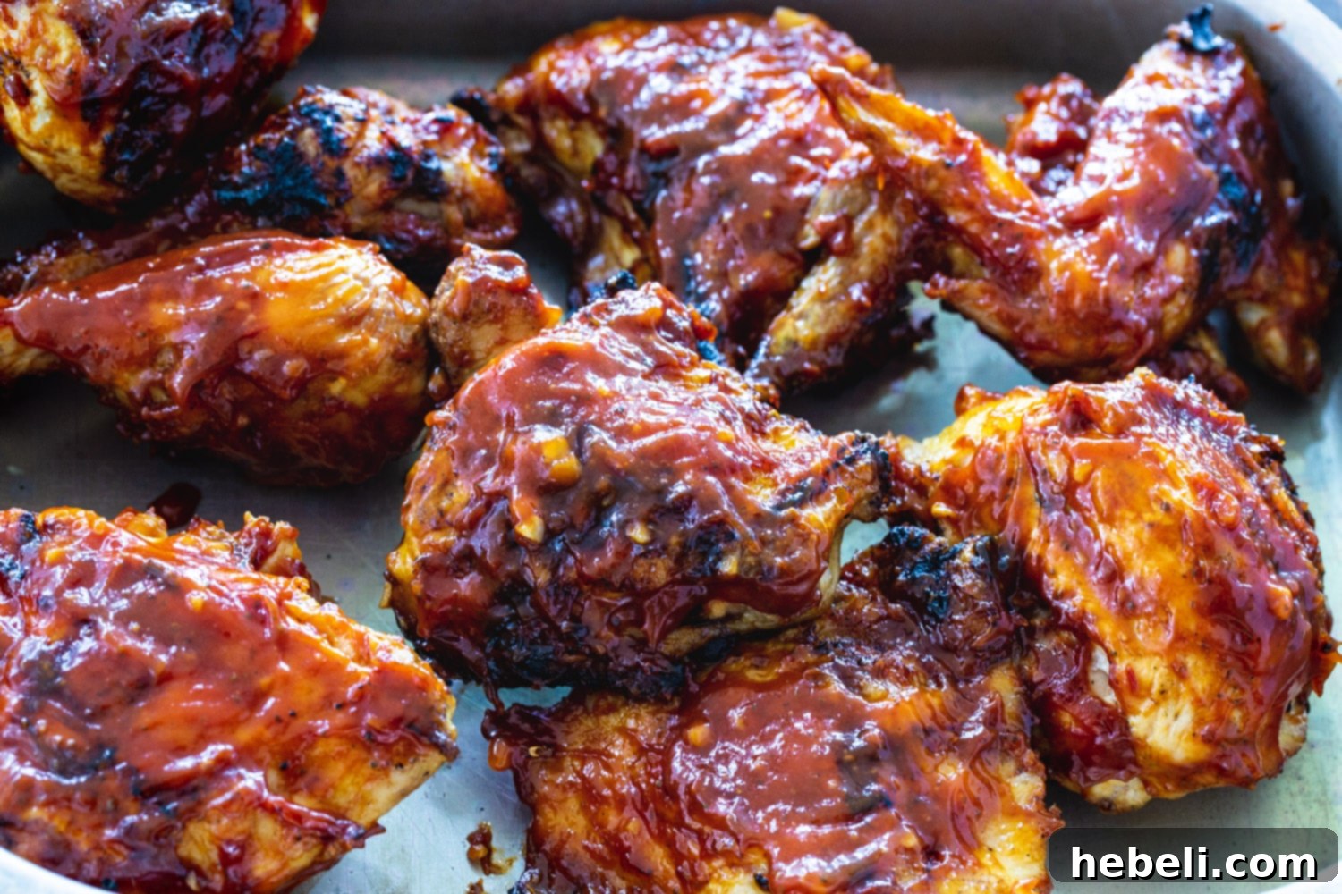 Smoky BBQ Grilled Chicken 2 Pieces of BBQ Grilled Chicken in a pan, glistening with sauce