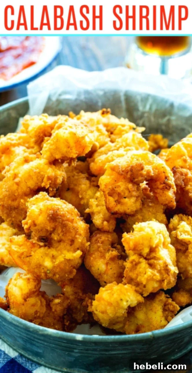 Close-up shot of golden, crispy Calabash Shrimp, showing the light, textured batter.