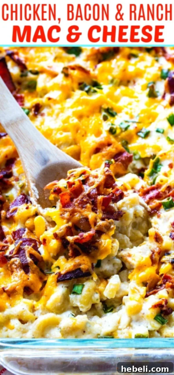 Loaded Chicken Bacon and Ranch Mac and Cheese 6 Extremely close-up shot of rich and creamy Chicken Bacon & Ranch Mac and Cheese in a bowl, showing the melted cheese, crispy bacon, and tender chicken texture.