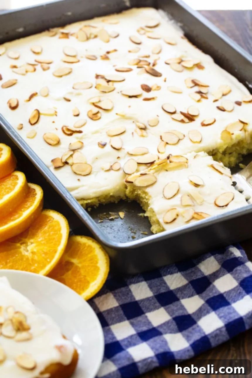 Golden Orange Almond Delight 3 The full Orange Almond Sheet Cake, freshly baked in a 9x13-inch pan, before being frosted. A perfect dessert for summer gatherings.