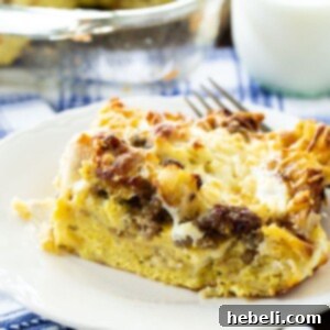 A small image of a slice of English Muffin Breakfast Casserole, showing the layers of ingredients.