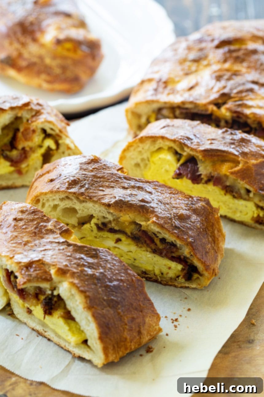 Close-up of golden, baked Stromboli filled with bacon, eggs, and cheese