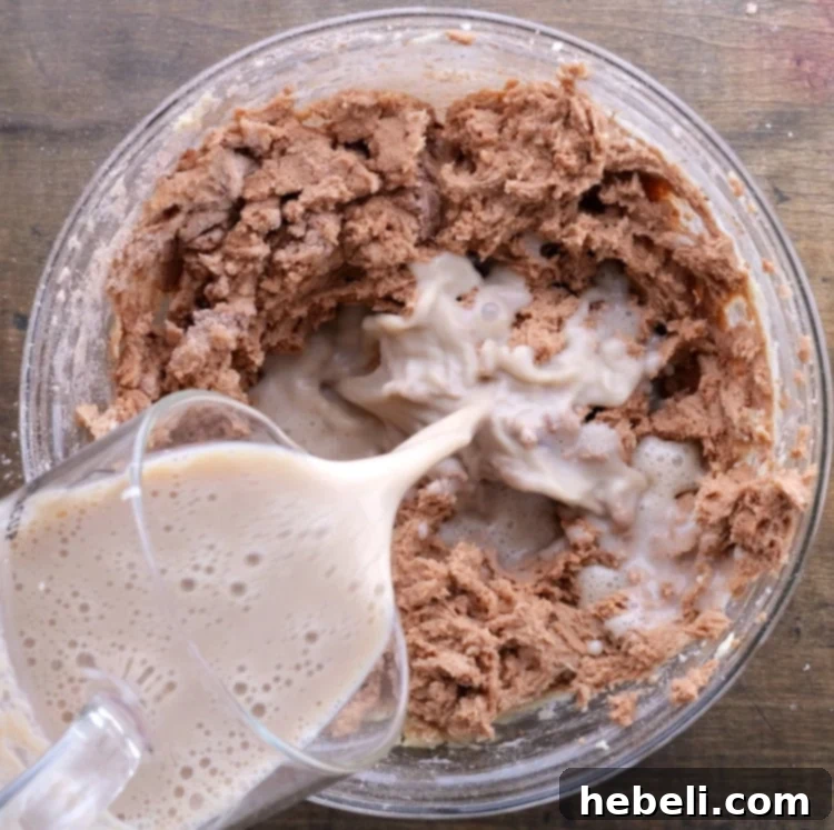 Grandma's Coca-Cola Cake 7 Alternating addition of buttermilk and Coca-Cola mixture into the cake batter.