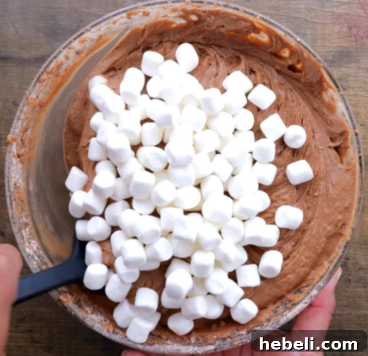 Grandma's Coca-Cola Cake 8 Stirring mini marshmallows into the Coca-Cola cake batter.