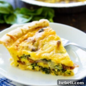 A beautifully baked Bacon Florentine Quiche with a golden crust.