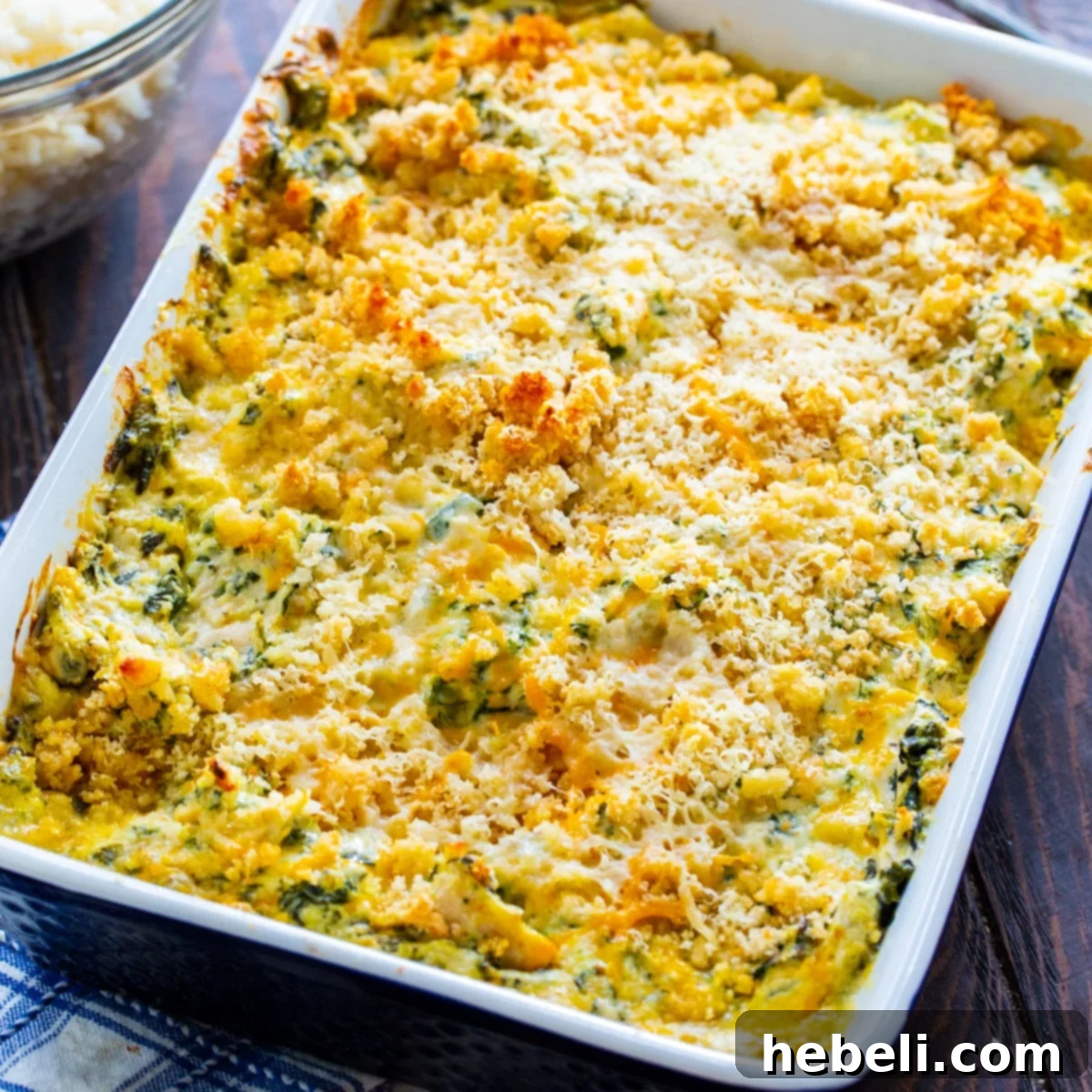 Creamy Chicken Florentine Bake 2 Delicious Chicken Florentine Casserole in a baking dish, perfectly golden brown and bubbly, ready to be served.