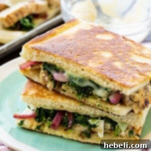 Close-up of a perfectly prepared Chicken Florentine Panini, displaying the crispy bread and melted cheese.