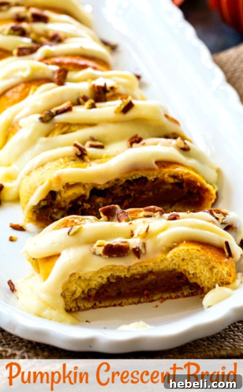 A slice of Pumpkin Braid on a plate next to the full braided pastry, showcasing its inviting texture and glaze.