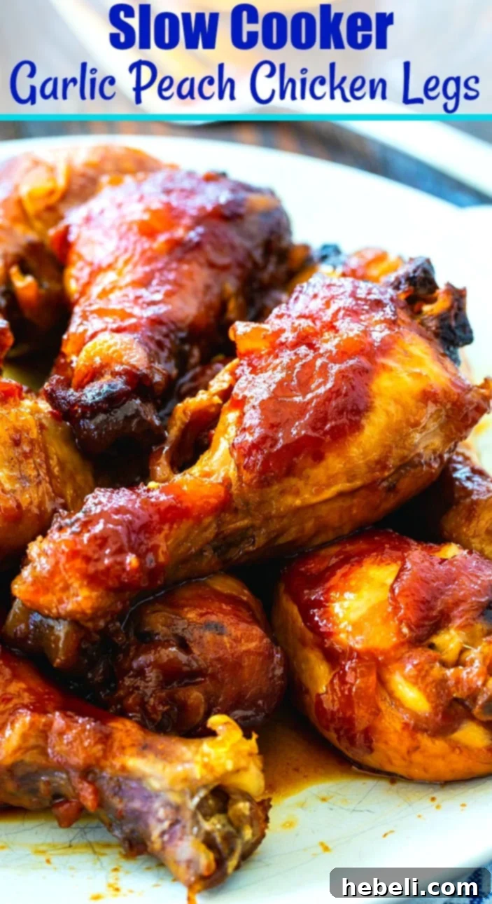A serving of Slow Cooker Garlic Peach Chicken Legs on a plate, with a side of green beans and mashed potatoes, highlighting a complete meal.