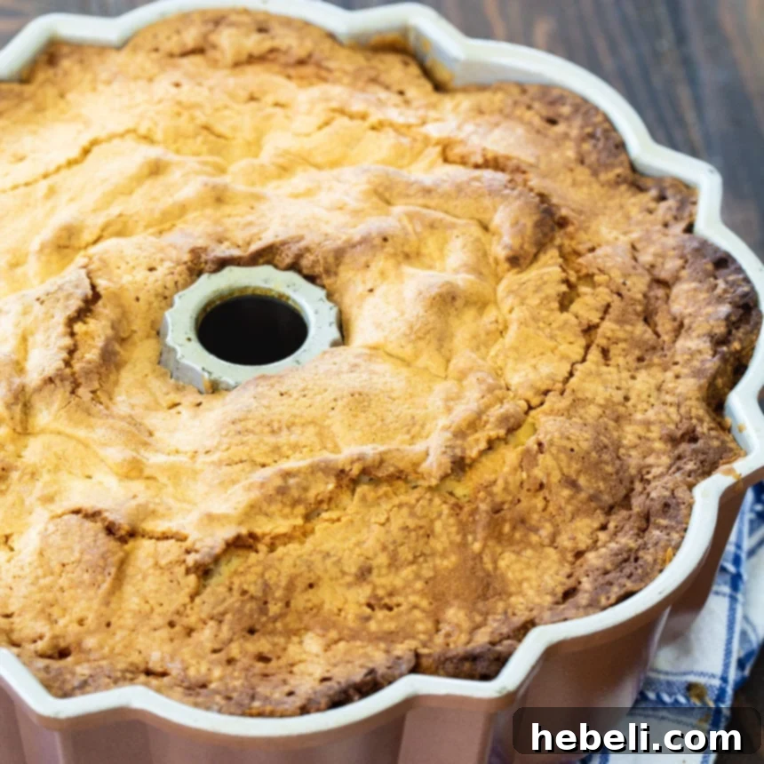 Luscious Coconut Cream Cheese Pound Cake 3 Coconut Cream Cheese Pound Cake baking in a classic bundt pan.