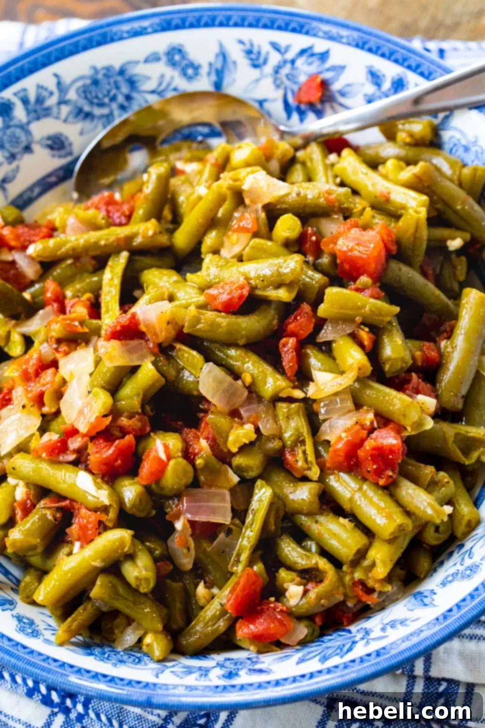 Southwestern Green Beans 4 Rotel Green Beans beautifully arranged in a blue and white serving bowl, garnished for presentation.